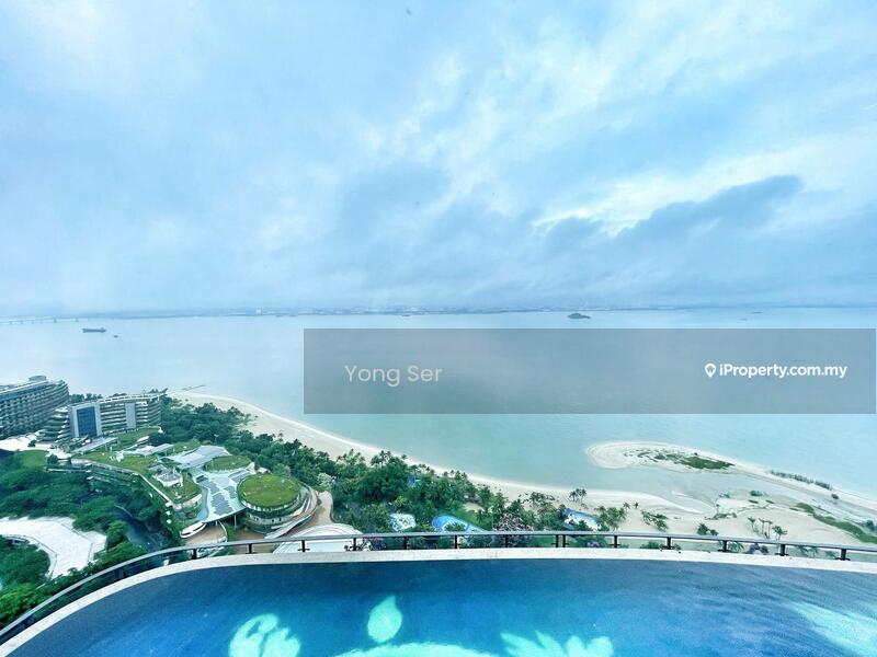 Exterior type: high-rise condominium; features: infinity pool, sea view, landscaped gardens, surrounding greenery, beachfront, outdoor amenities; style: modern.