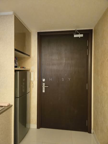 Room features: brown wooden door, silver door handle, white tiled flooring, cream painted walls, kitchen cabinetry, stainless-steel fridge, intercom panel.