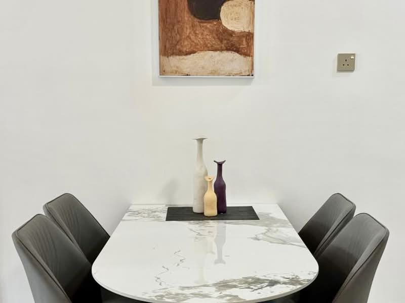 Dining features: marble dining table, 4 upholstered dining chairs in grey, decorative vases in white and purple, abstract wall art, white painted walls; style: modern.