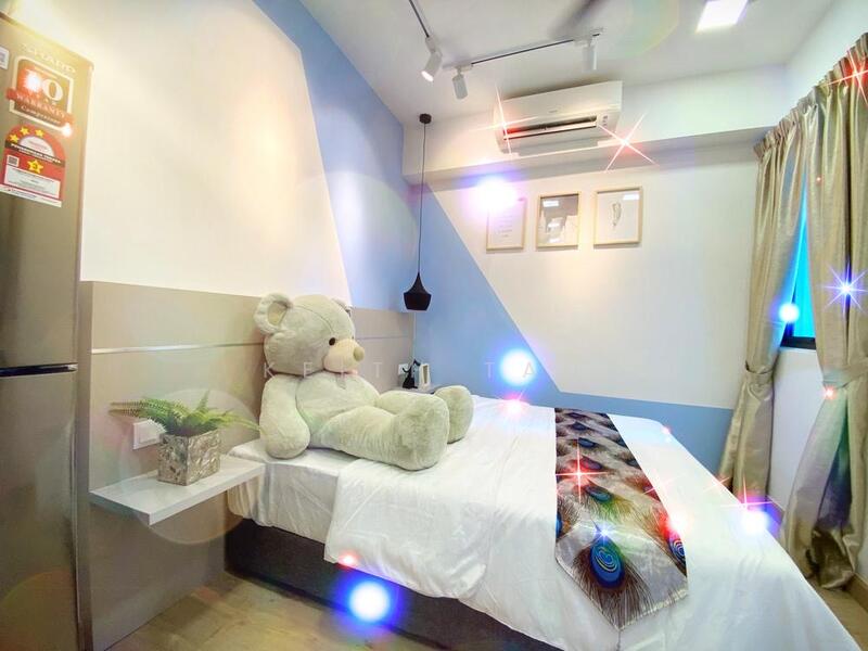 Bedroom features: queen-size bed with white bedding, large teddy bear on bed, light wood flooring, white painted walls, blue accent wall, wall-mounted air conditioning unit, curtains in neutral color, shelf beside bed, decorative wall art, recessed lighting, small potted plant on shelf; style: modern.