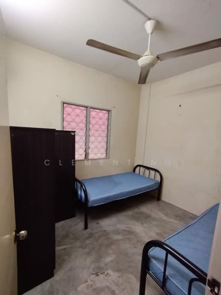 Bedroom features: two single beds with blue mattresses, ceiling fan, light-colored painted walls, concrete flooring, window with metal grille, wardrobe with sliding doors, natural light from window; style: minimalist.