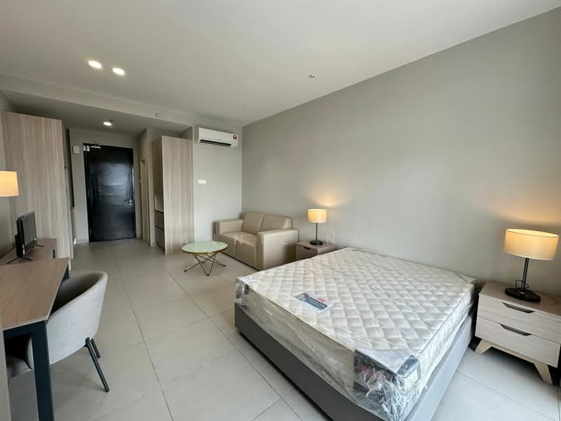 Room features: queen-size bed with mattress protector, light grey painted walls, tile flooring, sofa in light beige, wooden bedside table, table lamp with warm light, desk with chair, wall-mounted air conditioning unit, door leading to hallway, window with natural light; style: modern.