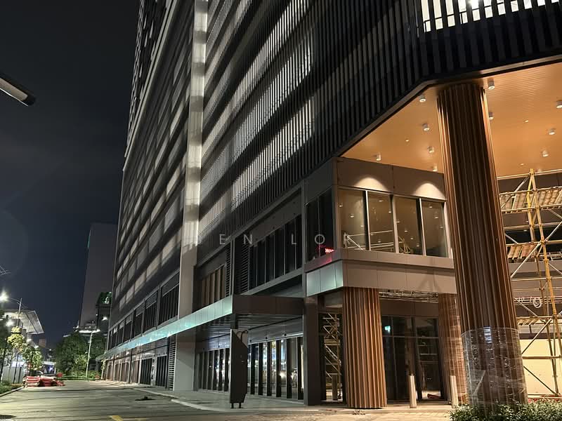 Exterior type: high-rise condominium; features: glass curtain wall, vertical fins, feature lighting at night, wood paneling at entrance, scaffolding visible, street view, manicured landscaping, modern architectural design; style: modern.