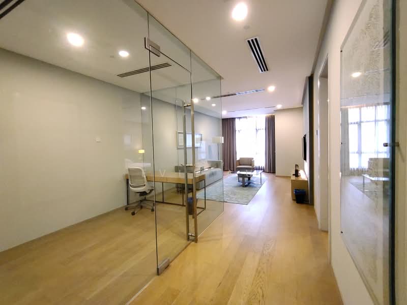 Study features: glass partition wall, wooden flooring, recessed downlights, desk with chair, floor-to-ceiling windows, curtains, wall-mounted TV, area rug, decorative artwork; style: modern; view: city.