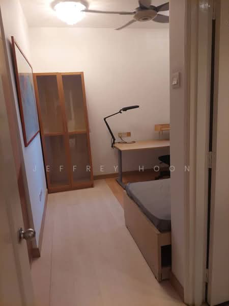 Study features: wooden flooring, white painted walls, ceiling fan, desk with lamp, bookshelf with glass doors, single bed, window with natural light, neutral color scheme; style: modern.