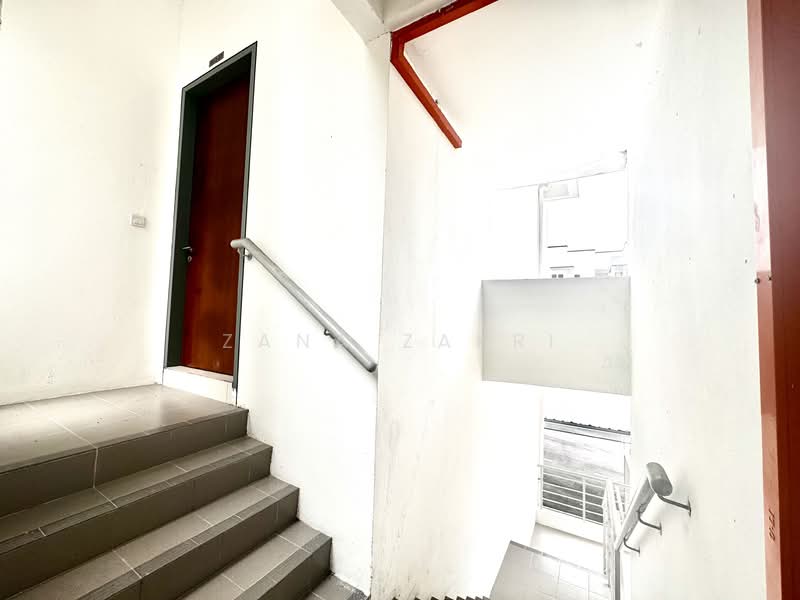 Room features: white painted walls, grey tiled flooring, metal handrail, wooden door, staircase, natural light from window; style: modern.