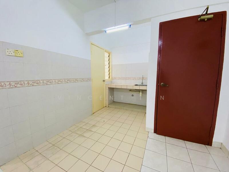 Room features: white tiled walls, light grey tiled flooring, single-basin sink, wall-mounted faucet, yellow door, red door, fluorescent ceiling light, decorative wall border.