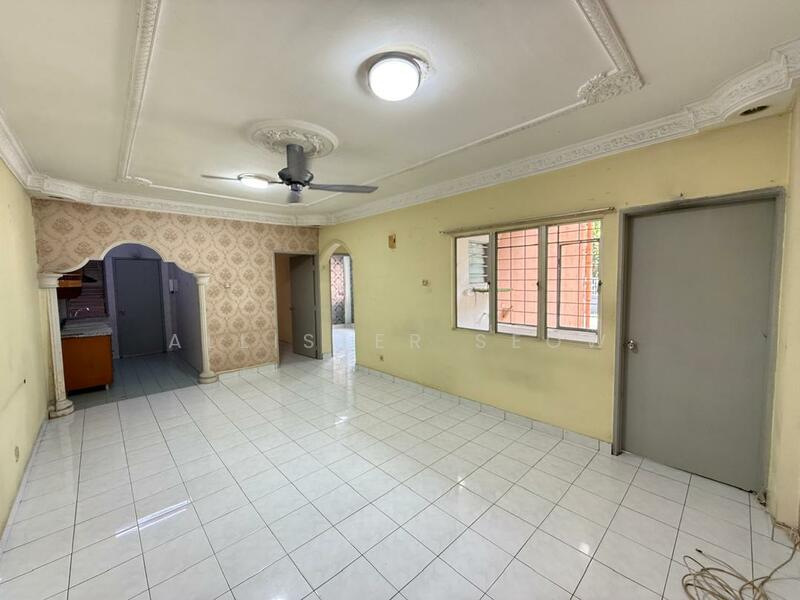 Living features: white painted walls, glossy white tile flooring, tray ceiling with decorative moulding, ceiling fan, large window with metal grille, door leading to another room, archway leading to kitchen, light fixture in ceiling; style: traditional.