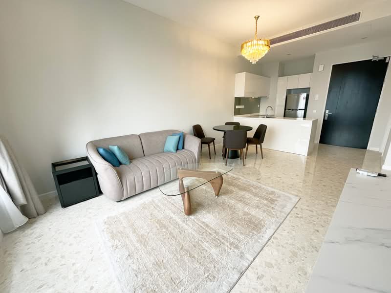 Living features: 3-seater fabric sofa in light grey, 2 blue accent cushions, glass coffee table with wooden base, area rug with neutral tones, marble flooring, chandelier light fixture, open-plan layout to kitchen, floor-to-ceiling windows with sheer curtains; style: modern. Dining features: 4-seater round dining table, black dining chairs, kitchen island with white cabinetry, built-in kitchen appliances, white countertop; style: modern.