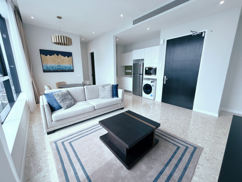 Living features: 3-seater fabric sofa in light grey, coffee table in black, area rug with geometric pattern, floor-to-ceiling windows, curtains in light beige, chandelier with multiple bulbs, wall-mounted TV, built-in cabinetry, recessed downlights, marble tile flooring; style: modern; view: city. Kitchen features: white cabinetry, stainless-steel fridge, built-in oven, freestanding washing machine, ceramic cooktop, countertop with backsplash, microwave, open shelving; style: modern.
