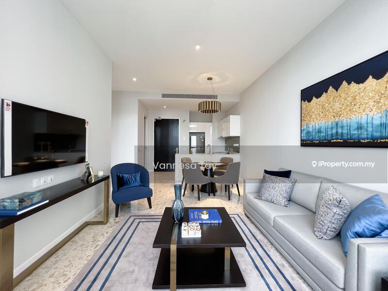 Living features: light grey fabric sofa, blue accent chair, black coffee table, wall-mounted TV, decorative wall art, recessed downlights, neutral wall colour, textured area rug, dining area visible in background; style: modern.