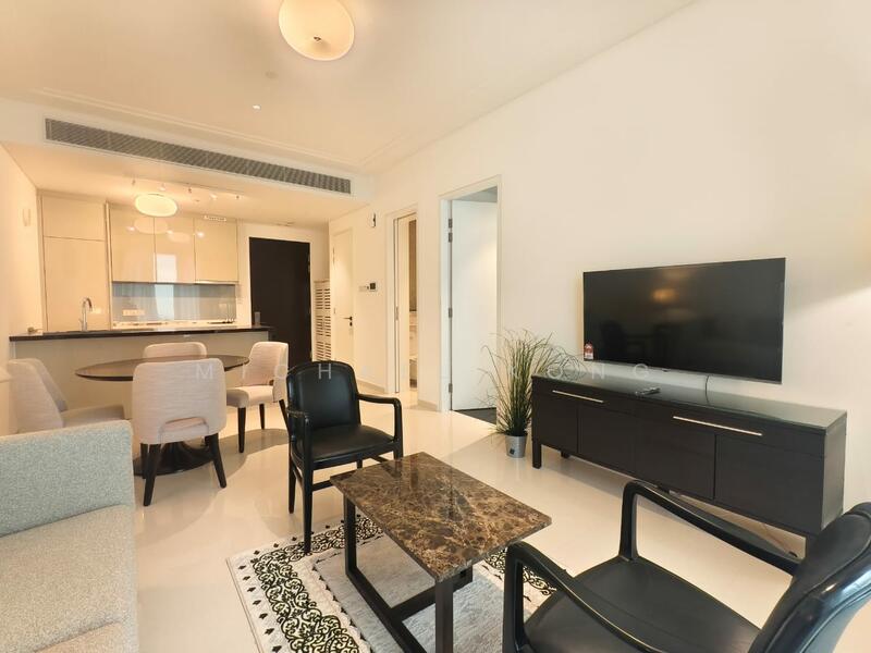 Living features: light-colored walls, white ceiling, recessed downlights, floor-to-ceiling windows, black TV console, wall-mounted TV, coffee table with marble top, 2-seater fabric sofa in light grey, 2 black armchairs, area rug with geometric pattern, decorative plant in ceramic pot; style: modern. Dining features: round dining table, upholstered dining chairs, open-plan layout connecting to living area; style: modern.