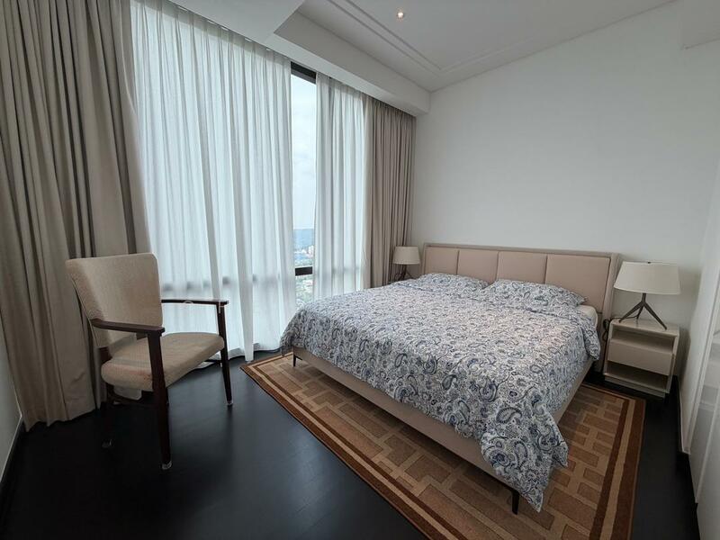 Bedroom features: king-size bed with upholstered headboard, bedding with floral pattern, two bedside lamps, wooden chair, area rug with geometric pattern, floor-to-ceiling windows, sheer curtains, dark wood flooring, white painted walls, recessed downlights; style: modern; view: city.