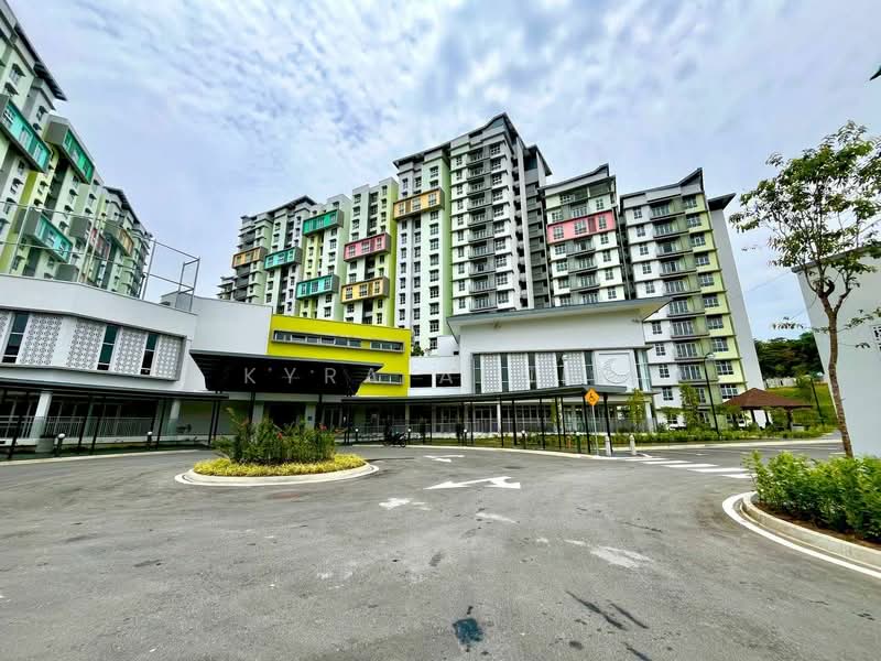 Exterior type: mid-rise condominium; features: colorful facade with green and yellow accents, multiple storeys, balconies on various units, landscaped entrance area, manicured lawn, paved driveway, surrounding greenery, modern architectural design; style: modern.