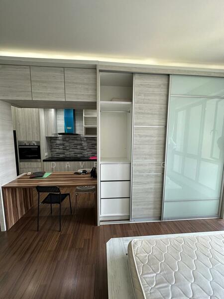 Room features: built-in wardrobe with sliding glass door, wooden flooring, study desk with wooden surface, black chair, grey cabinetry, kitchenette with built-in oven, grey tiled backsplash, open shelving, natural light from large windows; style: modern.