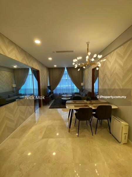 Living features: chevron-patterned feature wall, cream painted walls, marble flooring, large windows with sheer curtains, chandelier with multiple bulbs, sofa in grey fabric, coffee table, area rug with geometric pattern, dining table with four chairs, side table, decorative wall art; style: modern.