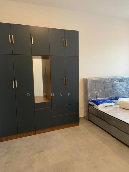 Bedroom features: grey built-in wardrobe with wooden accents, queen-size bed with mattress, light-colored walls, light-colored flooring, window with no visible treatment, decorative mirror on wardrobe, bedside area with no visible furniture; style: modern.