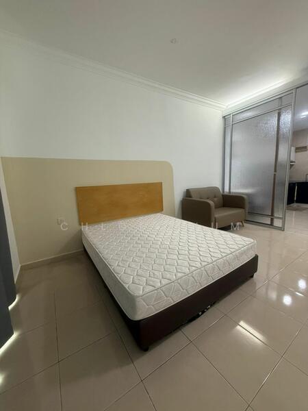 Bedroom features: queen-size bed with mattress, cream painted walls, glossy tile flooring, built-in wardrobe with sliding doors, sofa chair in brown fabric, recessed lighting, window with frosted glass, no visible decor; style: modern.