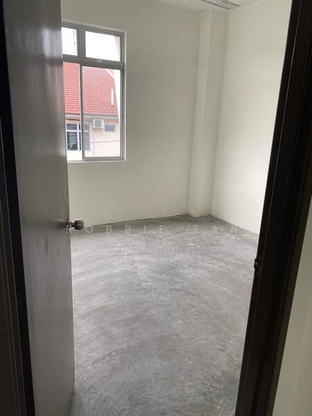 Room features: plain white walls, concrete flooring, single window, metal door, no visible furniture, neutral color scheme, high ceiling, unfurnished; style: minimalist.