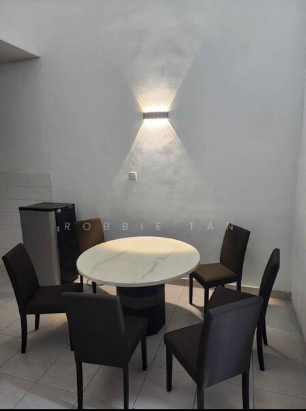 Dining features: round marble dining table, 4 upholstered dining chairs in dark fabric, white painted walls, tile flooring, wall-mounted light fixture, small fridge, neutral color palette; style: modern.
