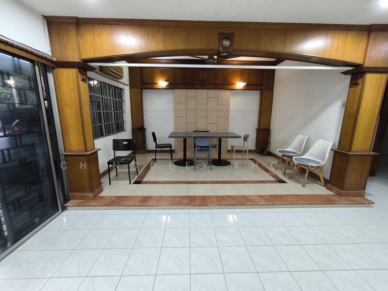 Room features: white tiled flooring, wood paneling on walls, recessed downlights, ceiling fan, large windows, sliding glass door, open layout, decorative archway, neutral wall color, square dining table, four chairs, built-in cabinetry, air conditioning unit; style: modern; view: garden.