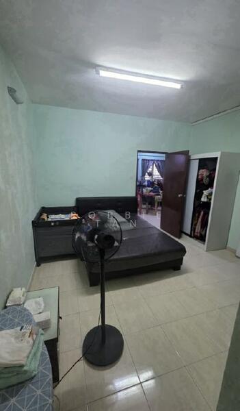 Bedroom features: green painted walls, tile flooring, queen-size bed, black bed frame, nightstand, standing fan, built-in wardrobe, door to another room.