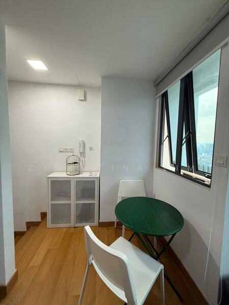 Room features: white painted walls, wooden flooring, large windows, green round table, two white chairs, glass cabinet, wall-mounted air conditioning unit, light fixture on ceiling; style: modern; view: city.