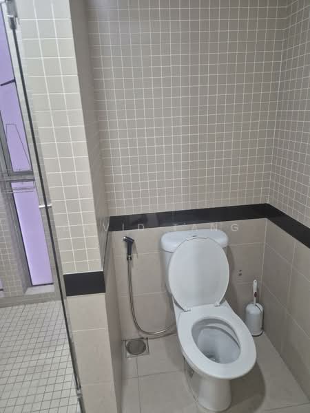 Bathroom features: white toilet, bidet spray, cream tiled walls, black accent tile, glass shower enclosure, tile flooring, floor drain, toilet paper holder; style: modern.