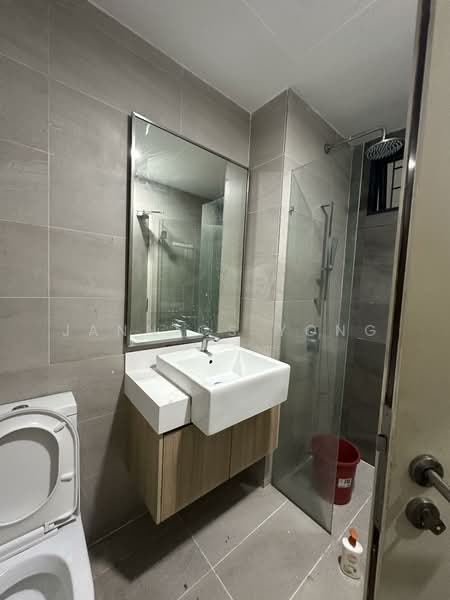 Bathroom features: single-sink vanity with wood cabinet, white ceramic sink, chrome basin mixer faucet, framed mirror, walk-in shower with glass enclosure, rain shower head, toilet, grey tiled walls, grey tiled flooring, shower wall with chrome fixtures, built-in shelving in shower area; style: modern.