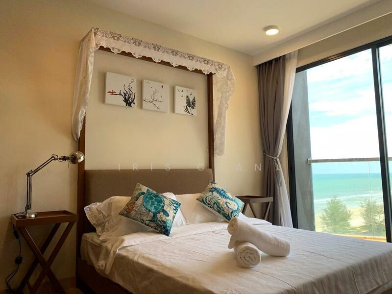 Bedroom features: king-size bed, upholstered headboard, white bedding, decorative pillows with blue patterns, bedside tables, table lamp, floor-to-ceiling windows, curtains, ocean view; style: modern; view: sea.