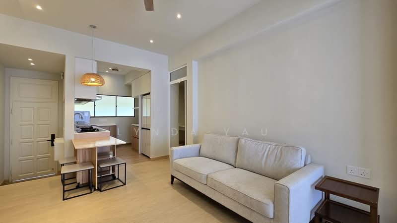 Living features: light wood flooring, white painted walls, sofa in cream fabric, wooden side table, pendant light fixture, ceiling fan, open layout to kitchen, large window for natural light; style: modern. Kitchen features: kitchen island with wooden countertop, stainless-steel sink, built-in cabinetry, open shelving, gas stove, exhaust hood, window above sink; style: modern.