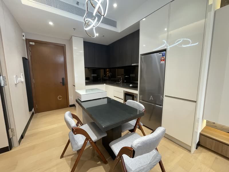 Kitchen features: black countertop, white cabinetry, dark wood cabinetry, stainless-steel fridge, built-in oven, induction cooktop, modern pendant lighting, 4 dining chairs, light wood flooring, wall-mounted cabinets, black backsplash, open layout; style: modern.