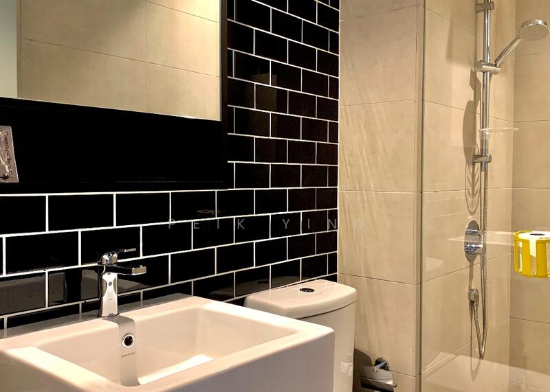 Bathroom features: black subway tile walls, light grey tiled walls, white square sink, chrome basin mixer faucet, one-piece toilet, glass shower enclosure, handheld shower, wall-mounted showerhead, mirror above sink, yellow toilet paper holder; style: modern.