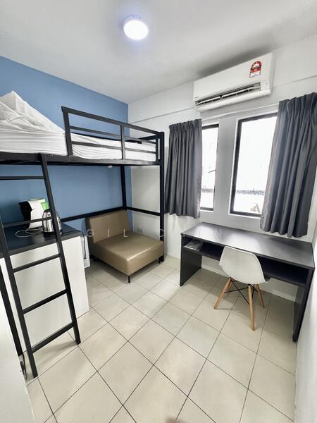 Bedroom features: bunk bed with white bedding, single bed with beige upholstery, desk with black surface, white chair with wooden legs, air conditioning unit on wall, two windows with grey curtains, tiled flooring, small refrigerator, light fixture on ceiling; style: modern.