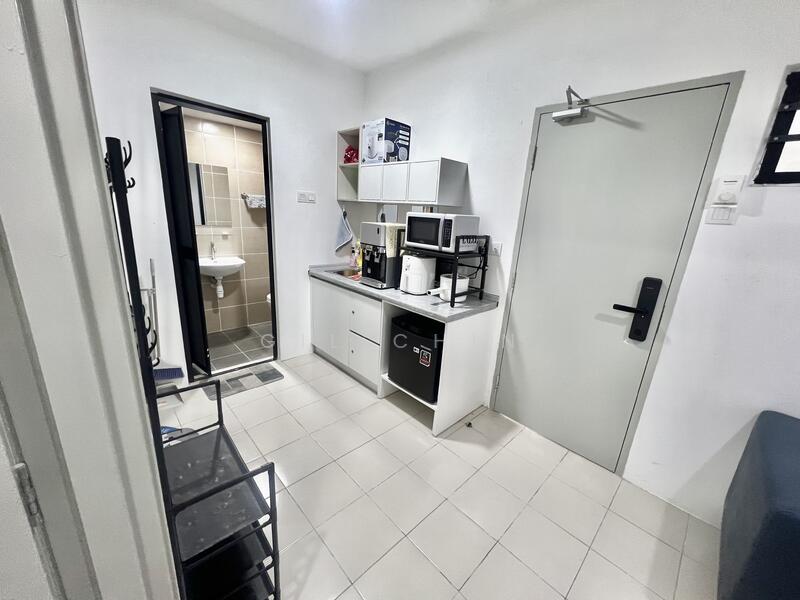 Room features: white painted walls, tile flooring, grey countertop, built-in cabinets, microwave, coffee machine, mini fridge, sink, wall-mounted mirror, shower area with glass door, toilet, light fixture; style: modern.
