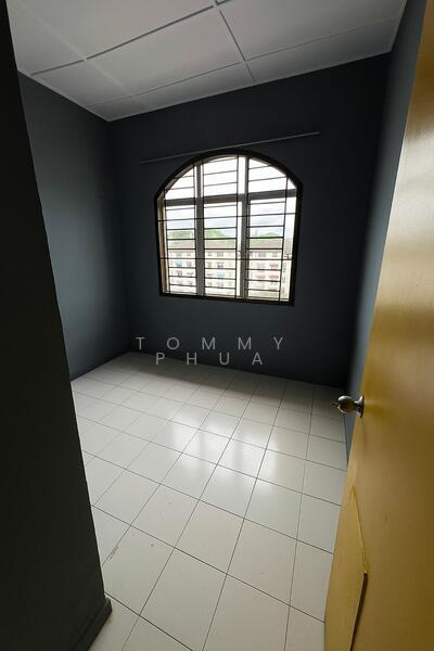 Room features: grey painted walls, white tiled flooring, arched window, window with grid design, single door with yellow finish, plain ceiling, no visible furniture, natural light from window.