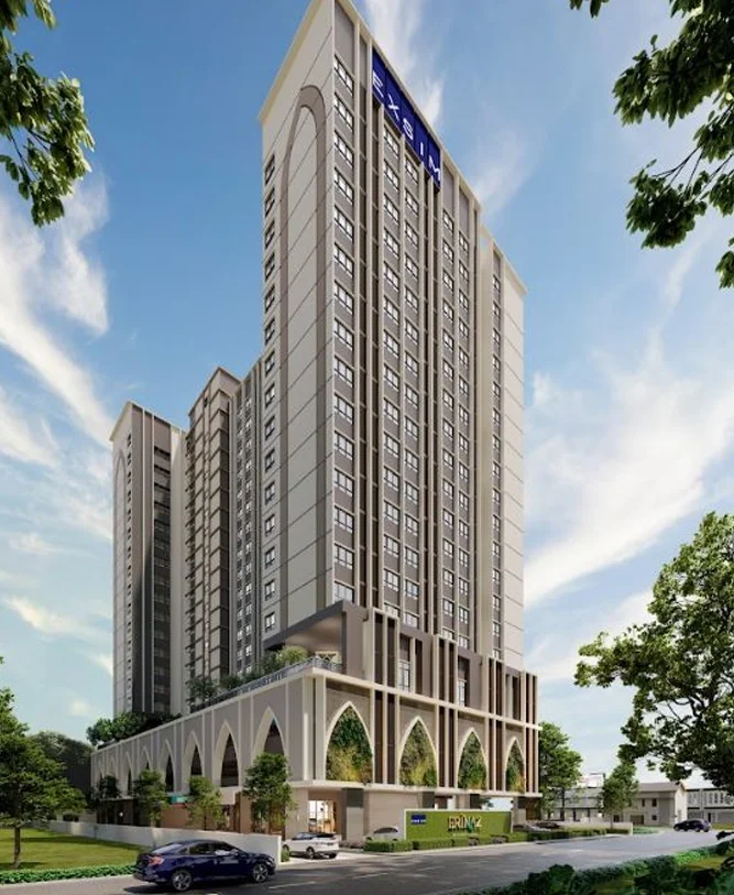 Exterior type: high-rise condominium; features: glass curtain wall, cream painted facade, recessed balconies, vertical fins, landscaped garden at base, manicured lawn, mature trees, driveway with interlocking pavers, double-volume main lobby, feature lighting at night; style: modern.