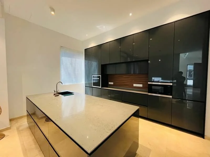 Kitchen features: black high-gloss cabinetry, wood accent panel, large kitchen island with stone countertop, built-in microwave, built-in oven, stainless-steel sink, chrome pull-down faucet, recessed downlights, tile flooring, window with sheer blinds; style: modern.