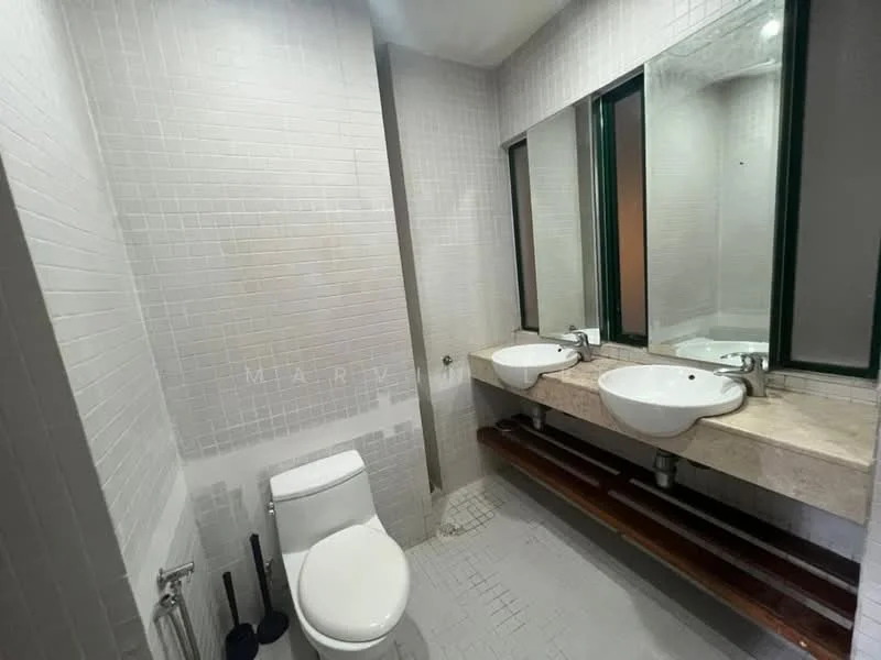 Bathroom features: white tiled walls, light grey tiled flooring, double-sink vanity with stone countertop, two round basins, chrome basin mixers, large wall-mounted mirrors, one-piece toilet, wooden shelf under the sinks, green-framed mirrors, recessed lighting; style: modern.