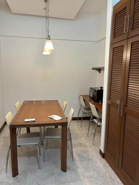 Dining features: wood dining table, 6-seater dining table, metal dining chairs, pendant lighting fixture, cream tiled flooring, white painted walls, built-in cabinetry with louvered doors, microwave, kitchenette area; style: modern.