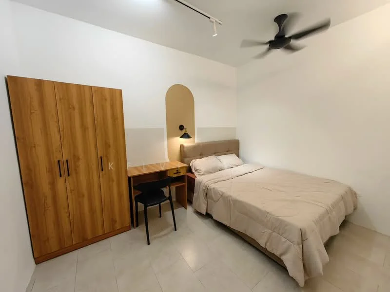 Bedroom features: queen-size bed with beige bedding, wooden wardrobe with two doors, study desk with chair, wall-mounted lamp, light-colored walls, tile flooring, ceiling fan, arched wall feature; style: modern.