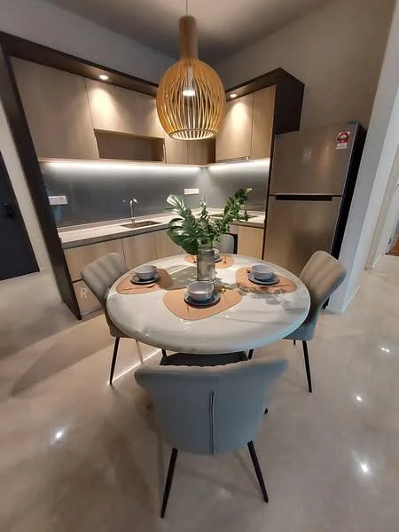 Kitchen features: round dining table, 4 upholstered dining chairs, white tabletop, wooden placemats, stainless-steel fridge, wood cabinetry, grey backsplash, under-cabinet lighting, single-bowl stainless-steel sink, chrome pull-down faucet, marble flooring, pendant light fixture; style: modern.