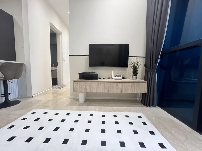 Living features: light-colored walls, marble flooring, large flat-screen TV, wooden TV console, decorative plant in pot, area rug with black and white pattern, floor-to-ceiling windows with dark curtains, open layout to adjacent room; style: modern.