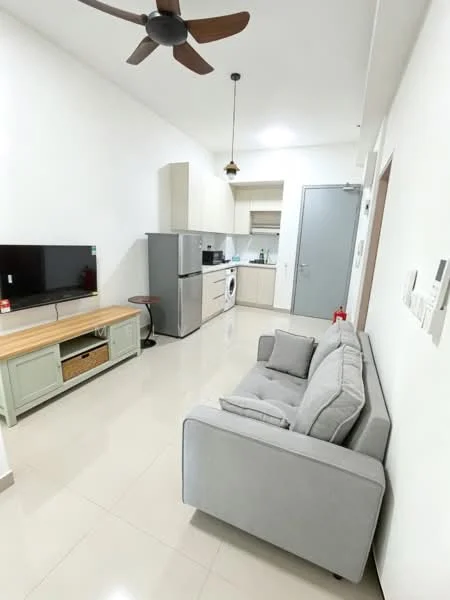 Living features: grey fabric sofa, wall-mounted TV, TV console with storage, refrigerator, built-in kitchen cabinets, washing machine, stainless-steel sink, light-colored countertop, ceiling fan with light, pendant light, cream painted walls, glossy tile flooring; style: modern.