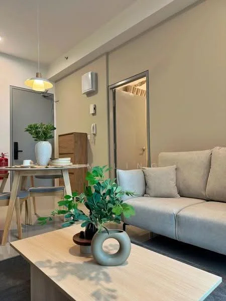 Living features: light grey fabric sofa, wooden coffee table, decorative vase with greenery, pendant light fixture, wall-mounted air conditioning unit, neutral painted walls, wooden dining table with chairs, doorway leading to another room; style: modern.