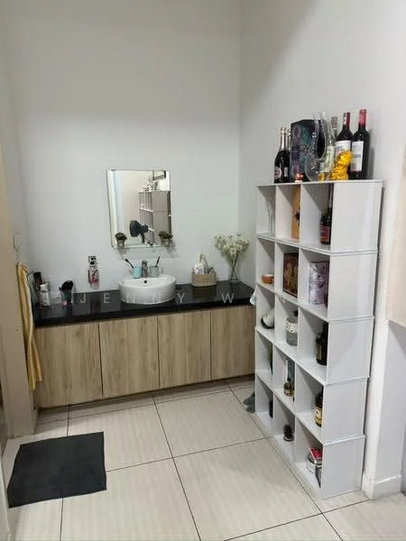 Bathroom features: single-bowl ceramic sink, chrome basin mixer faucet, mirror above sink, wooden vanity with light wood finish, black countertop, white tiled walls, white tiled flooring, open shelving unit, decorative items on shelves, hand towel hanging, small area rug, flower vase; style: modern.
