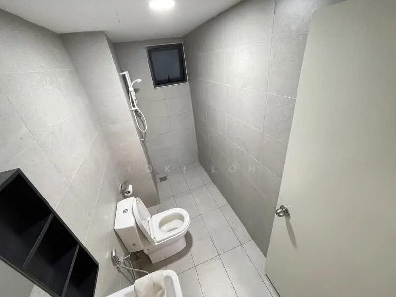 Bathroom features: grey tiled walls, white tiled flooring, one-piece toilet, shower with wall-mounted faucet, small window for natural light, built-in shelving unit, light fixture in ceiling, sliding door, neutral color scheme; style: modern.