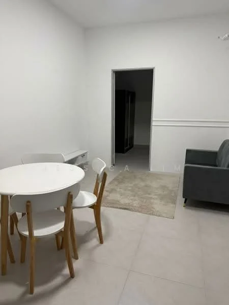 Dining features: round dining table with white surface, 4 white dining chairs with wooden legs, light grey area rug, white painted walls, tile flooring, sofa in grey fabric, doorway leading to another room; style: modern.