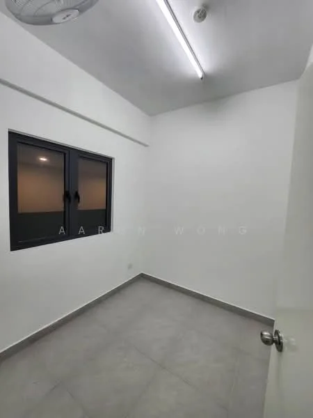 Room features: white painted walls, grey tile flooring, single window with black frame, ceiling light fixture, door with round handle.