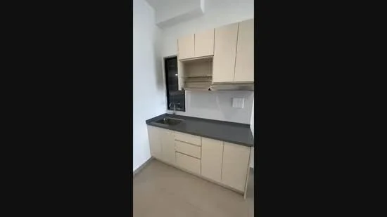 Kitchen features: light beige cabinetry, grey countertop, single-bowl stainless-steel sink, chrome pull-down faucet, wall-mounted upper cabinets, lower cabinets with drawers, tile backsplash, window above sink; style: modern.